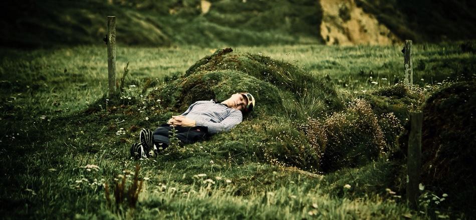 man lying asleep outside