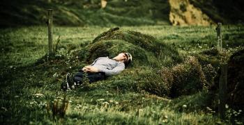 man lying asleep outside